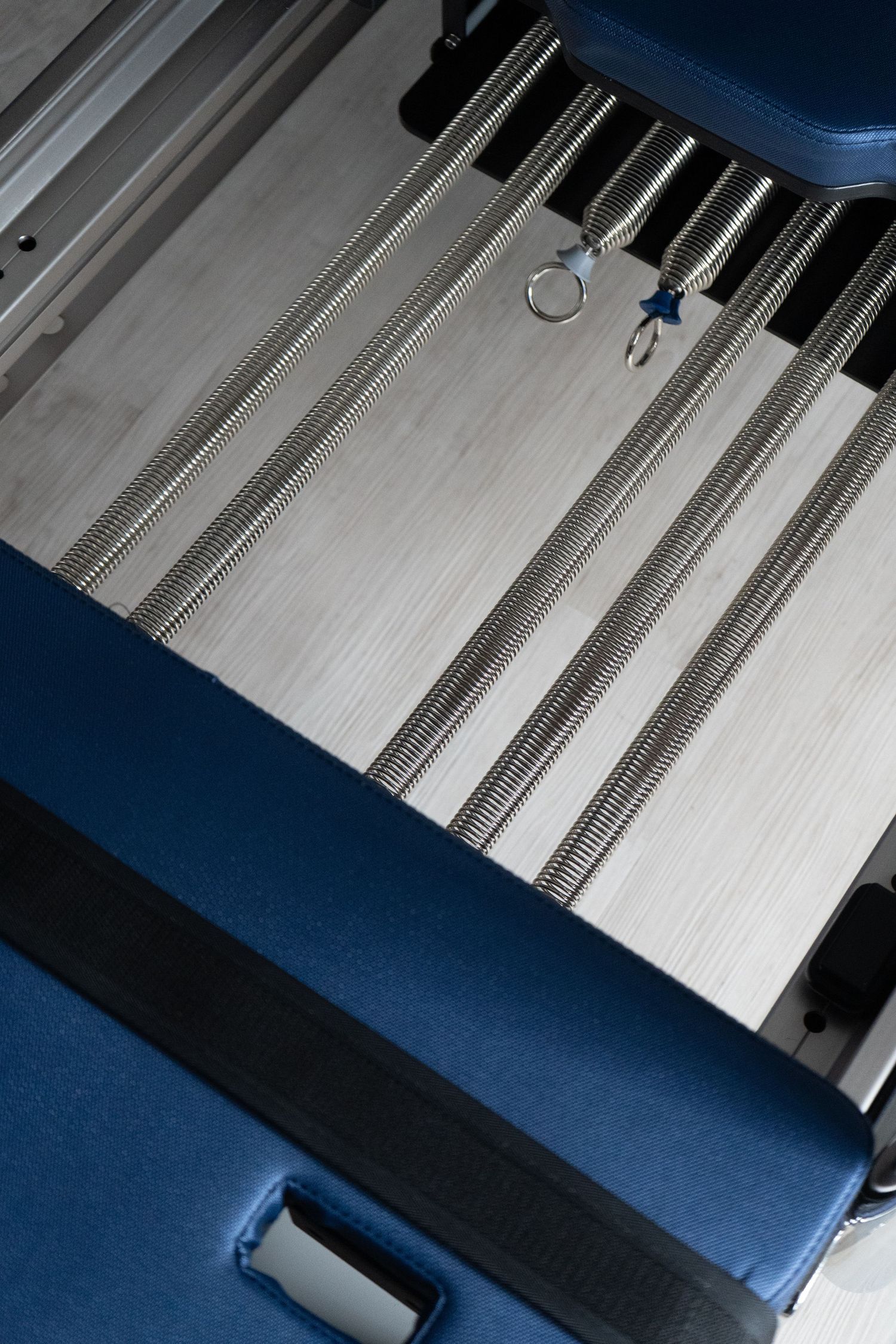 Close-up detail of metallic exercise equipment components with textured surface.