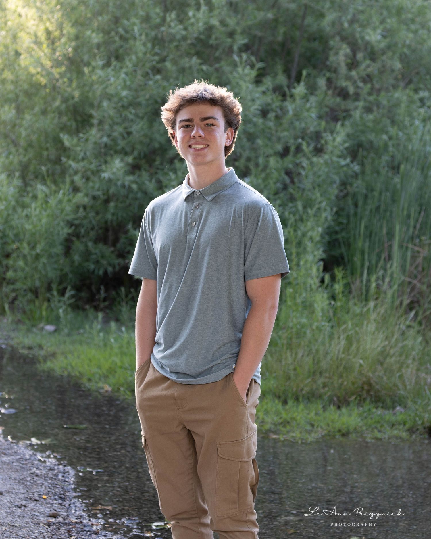 Young man near the river, ready to take on the world