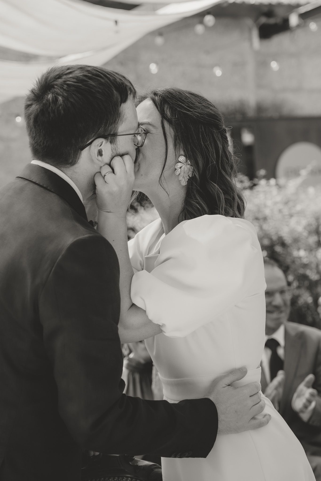 A tender moment shared between a couple during their wedding celebration.
