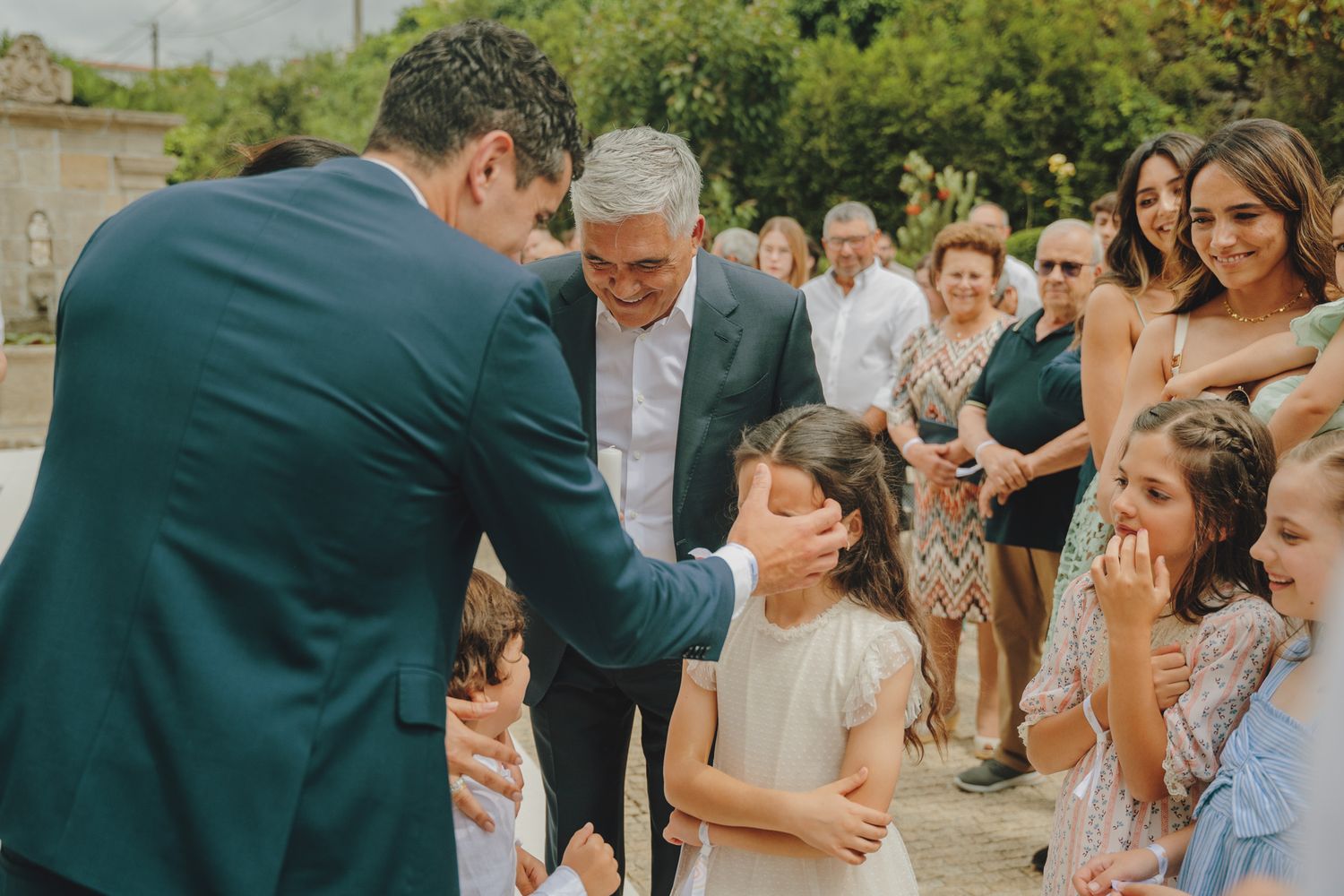 Outdoor gathering of guests celebrating a special occasion.