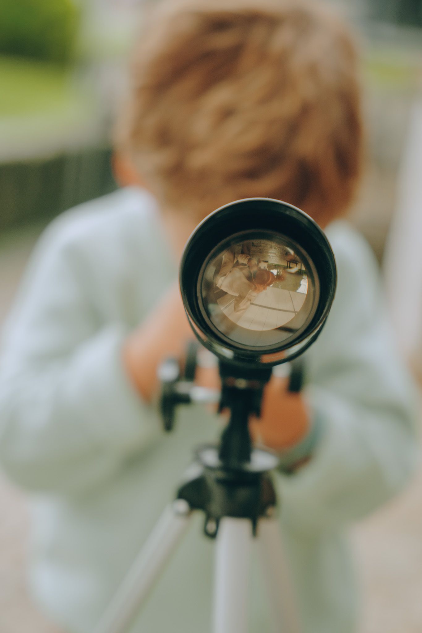 Close-up sequence showing telescope lens and viewing equipment.