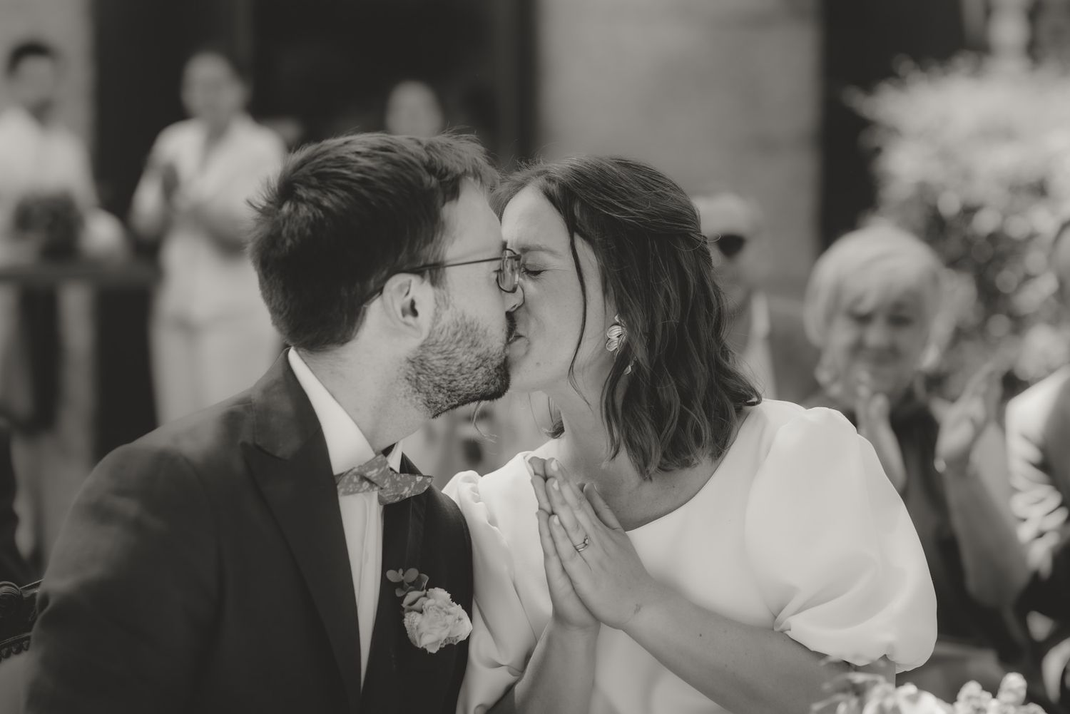 Tender moments shared between couples at an outdoor wedding celebration.