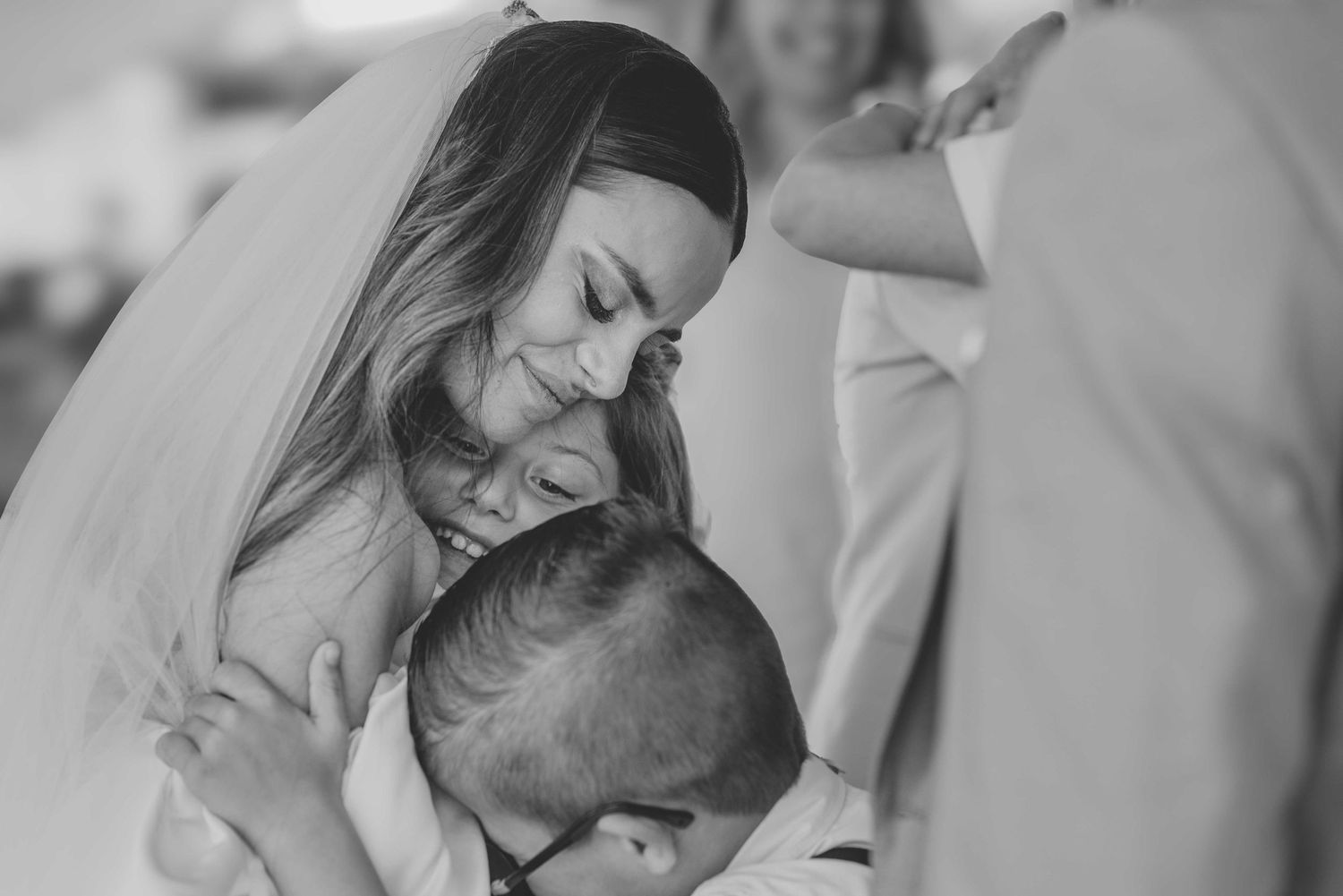 A romantic black and white wedding photo collage showing intimate moments between newlyweds during their special day.