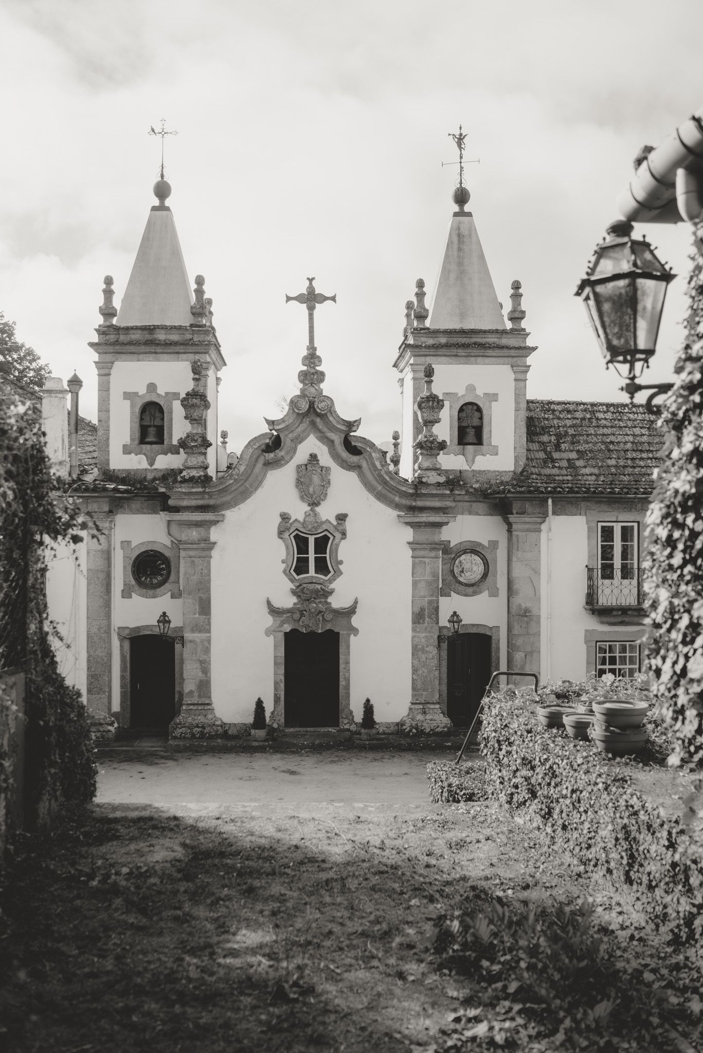 Historic white church facade with twin bell towers and ornate architectural details.