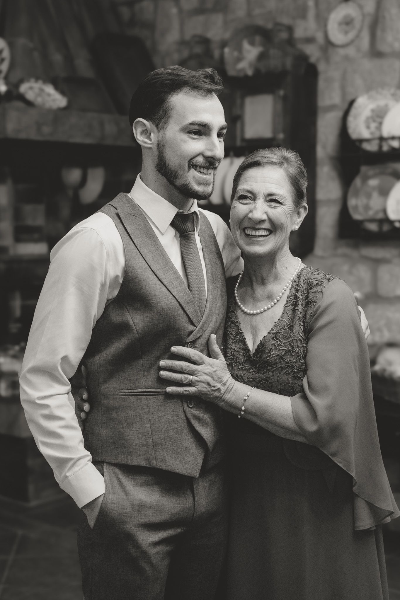 Wedding party sharing joyful moments in formal attire.