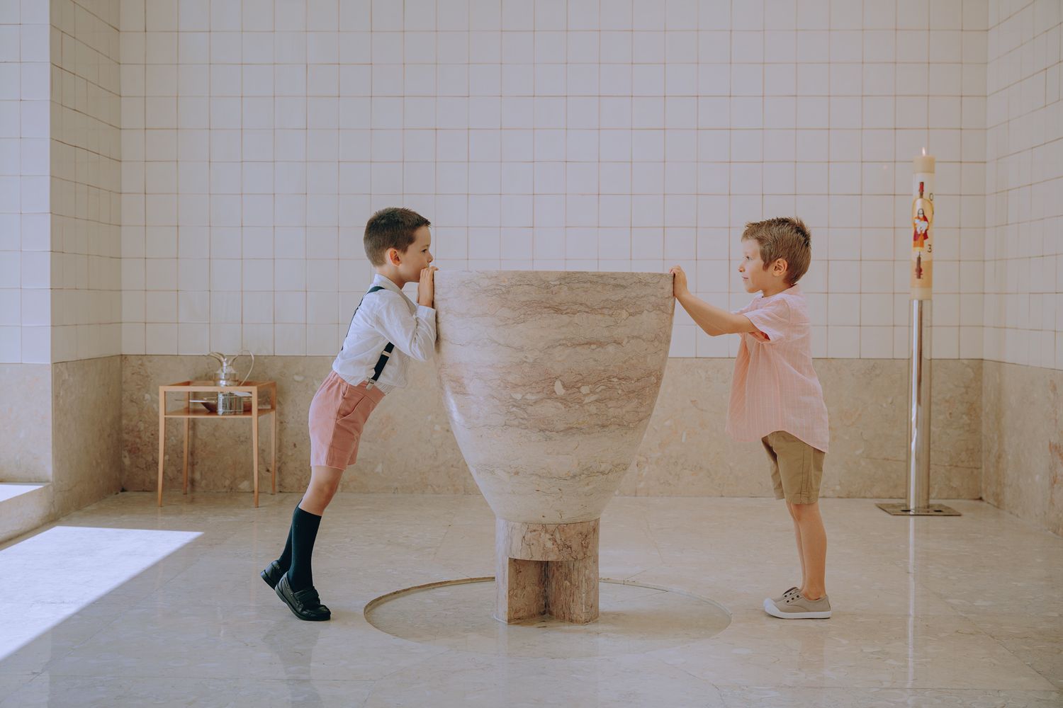 A sequence of dance movements shown in multiple frames against a minimalist beige interior space.