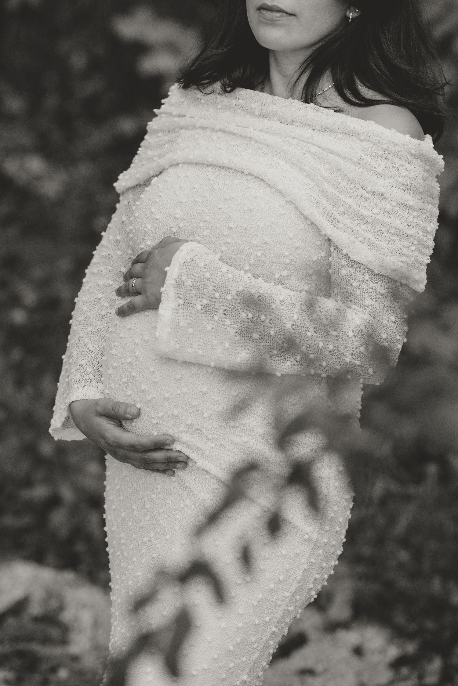 Close-up black and white photos of delicate lace fabric with intricate patterns.