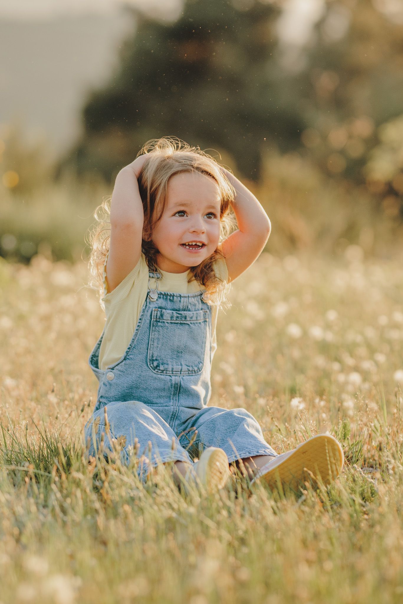 A carefree moment captured in a sun-drenched field of wildflowers.