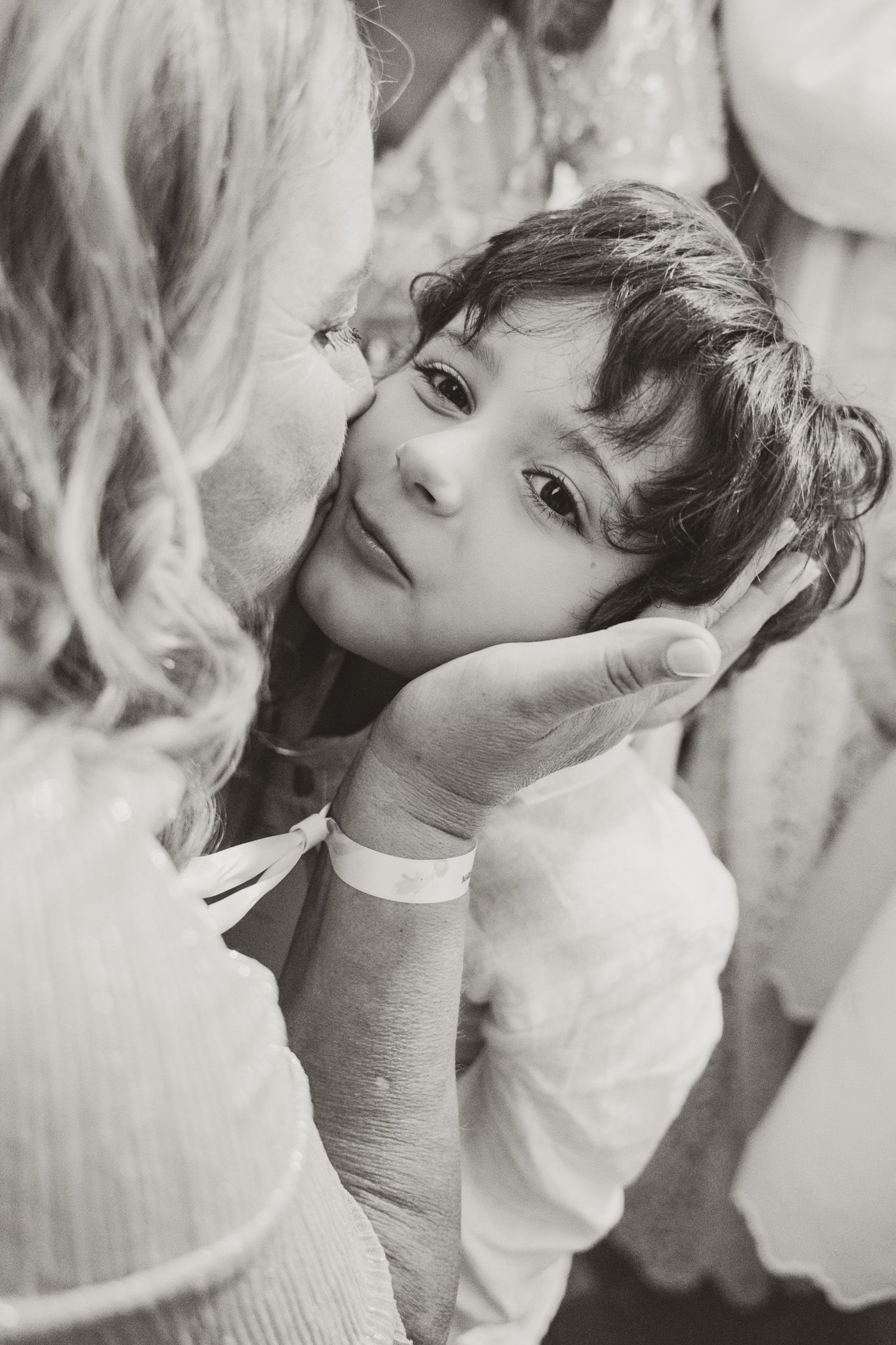 Close-up sequence of a child during a religious ceremony.