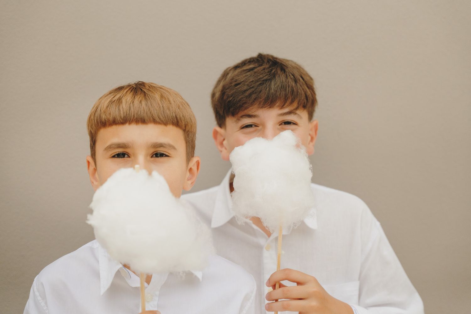 Group of children wearing white face masks and formal attire.