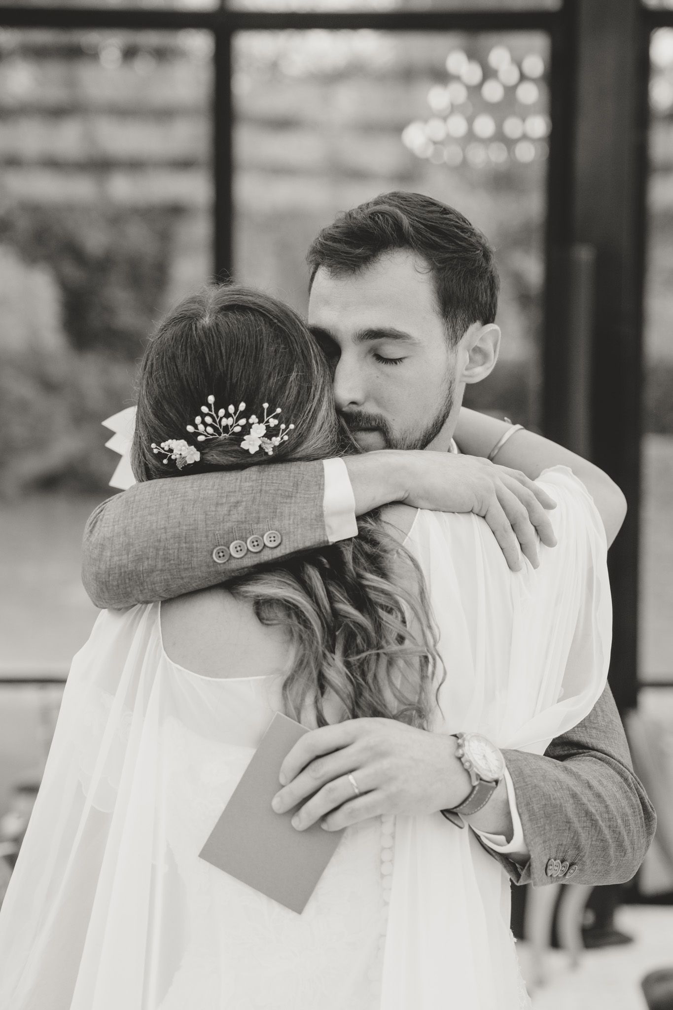 Black and white wedding photo series showing intimate moments between newlyweds during their first dance.