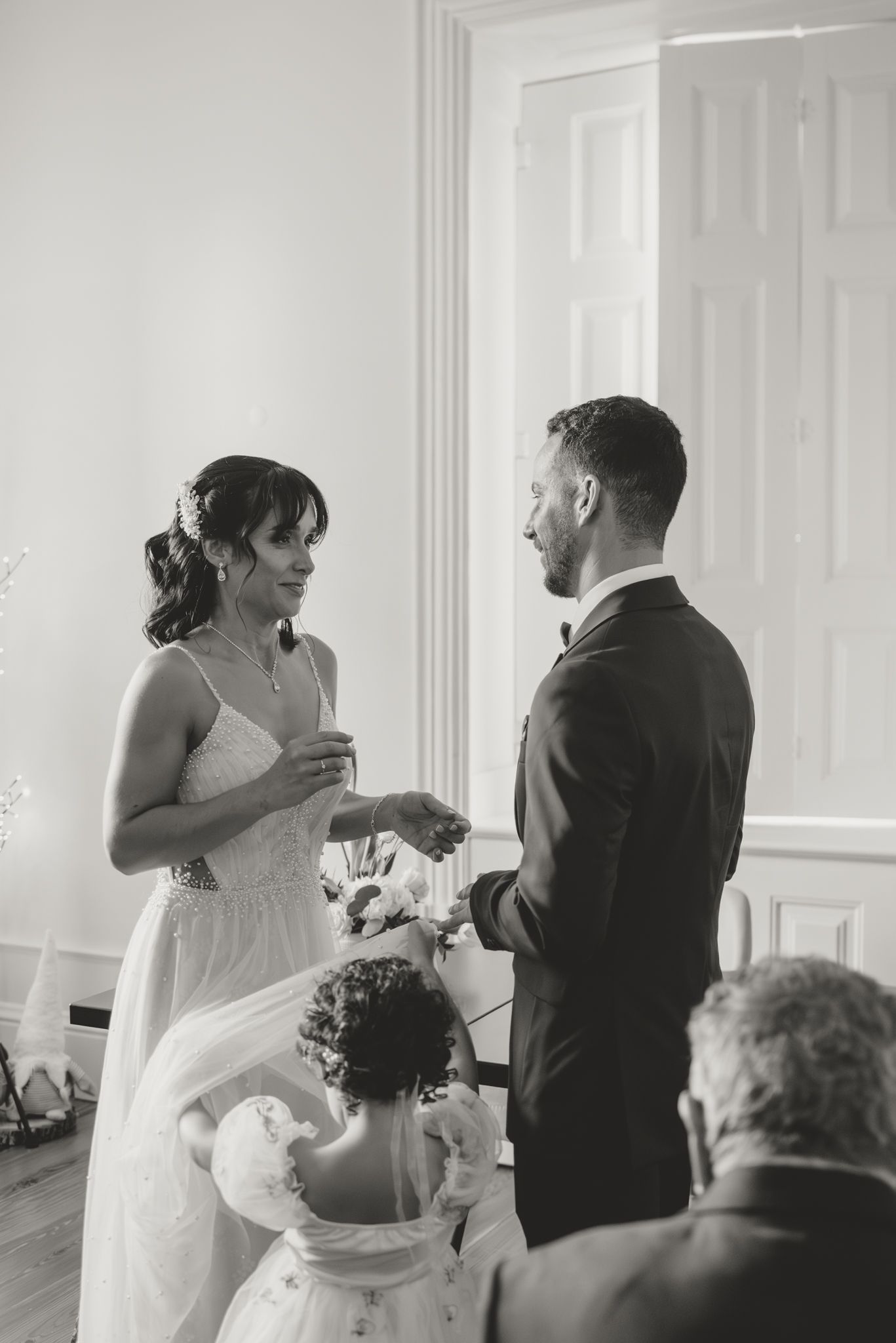Series of candid moments during wedding ceremony showing couple and flower girl.