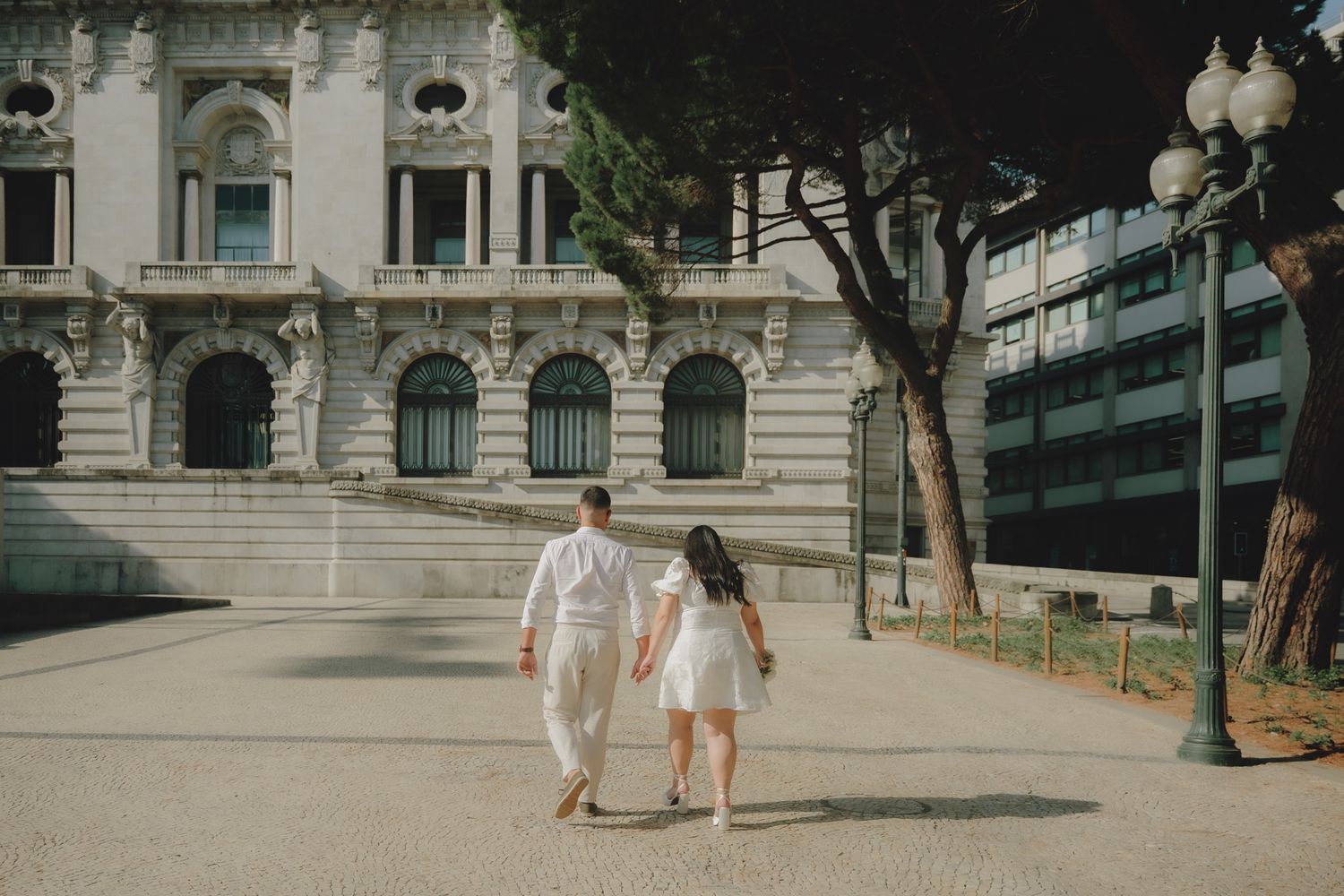 Elegant architectural setting with classical building facade and stone pathways.