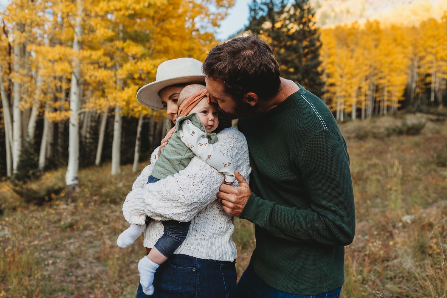 Intimate outdoor portrait with stunning fall colors and mountain scenery in the background.