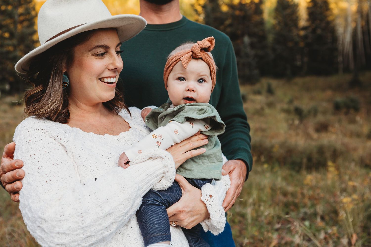 Joyful outdoor moment captured against a backdrop of autumn mountain scenery.