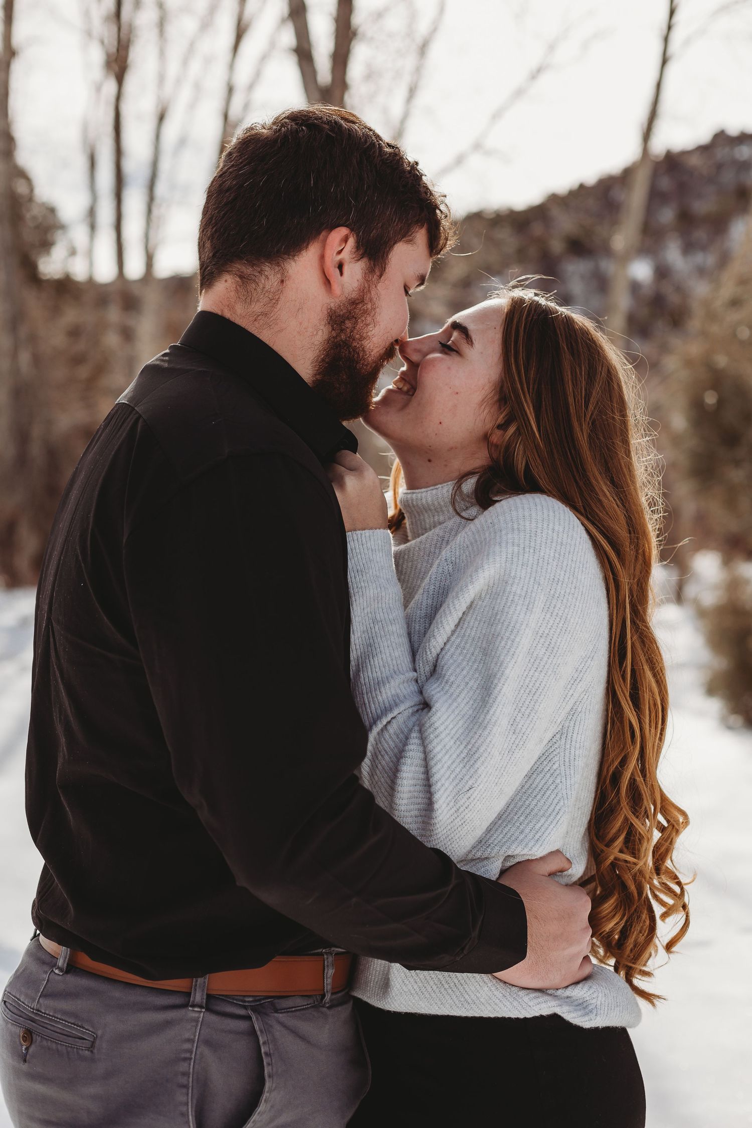 Close embrace captured in warm winter afternoon light.