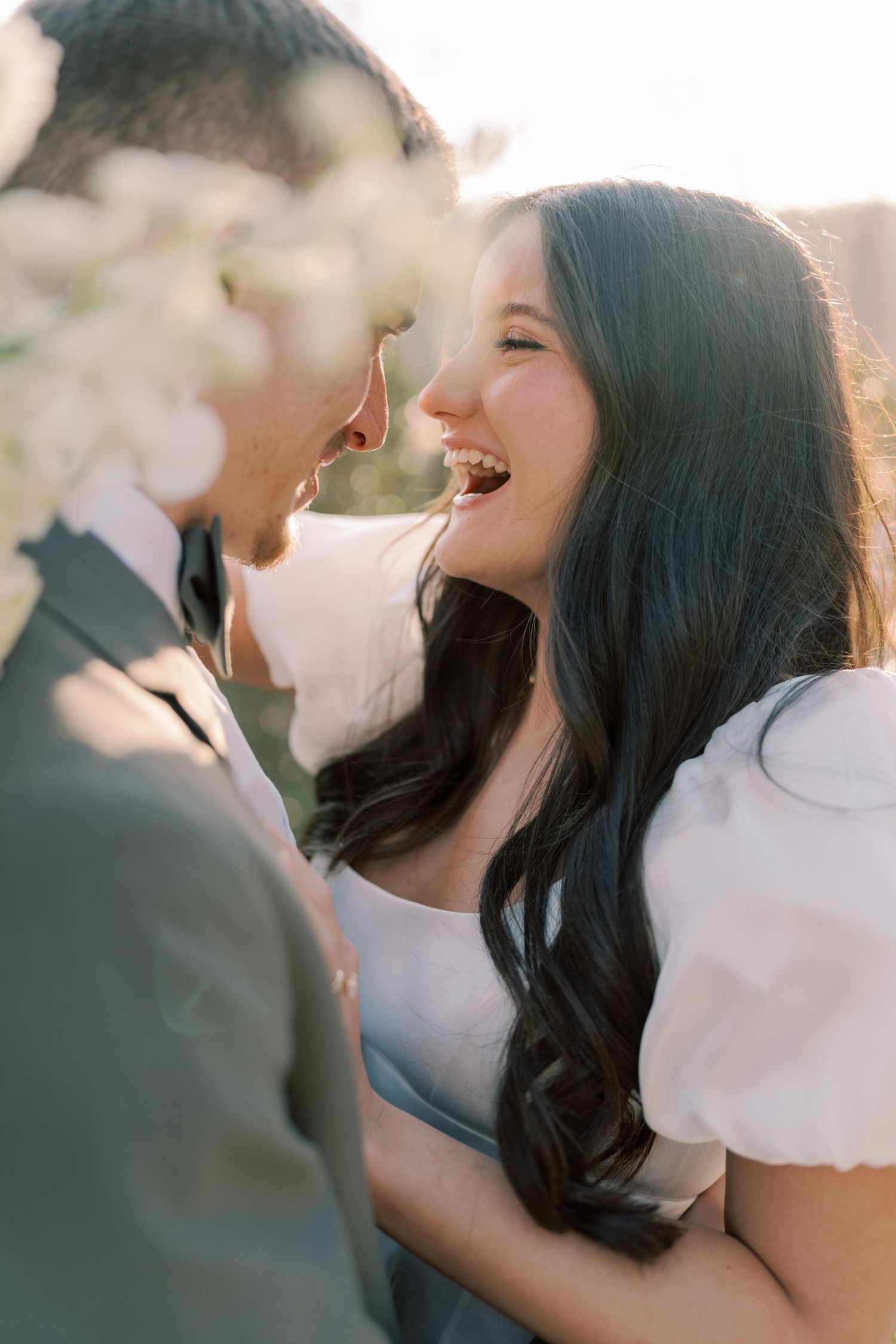 Romantic sunset wedding portraits showing intimate moments between newlyweds.