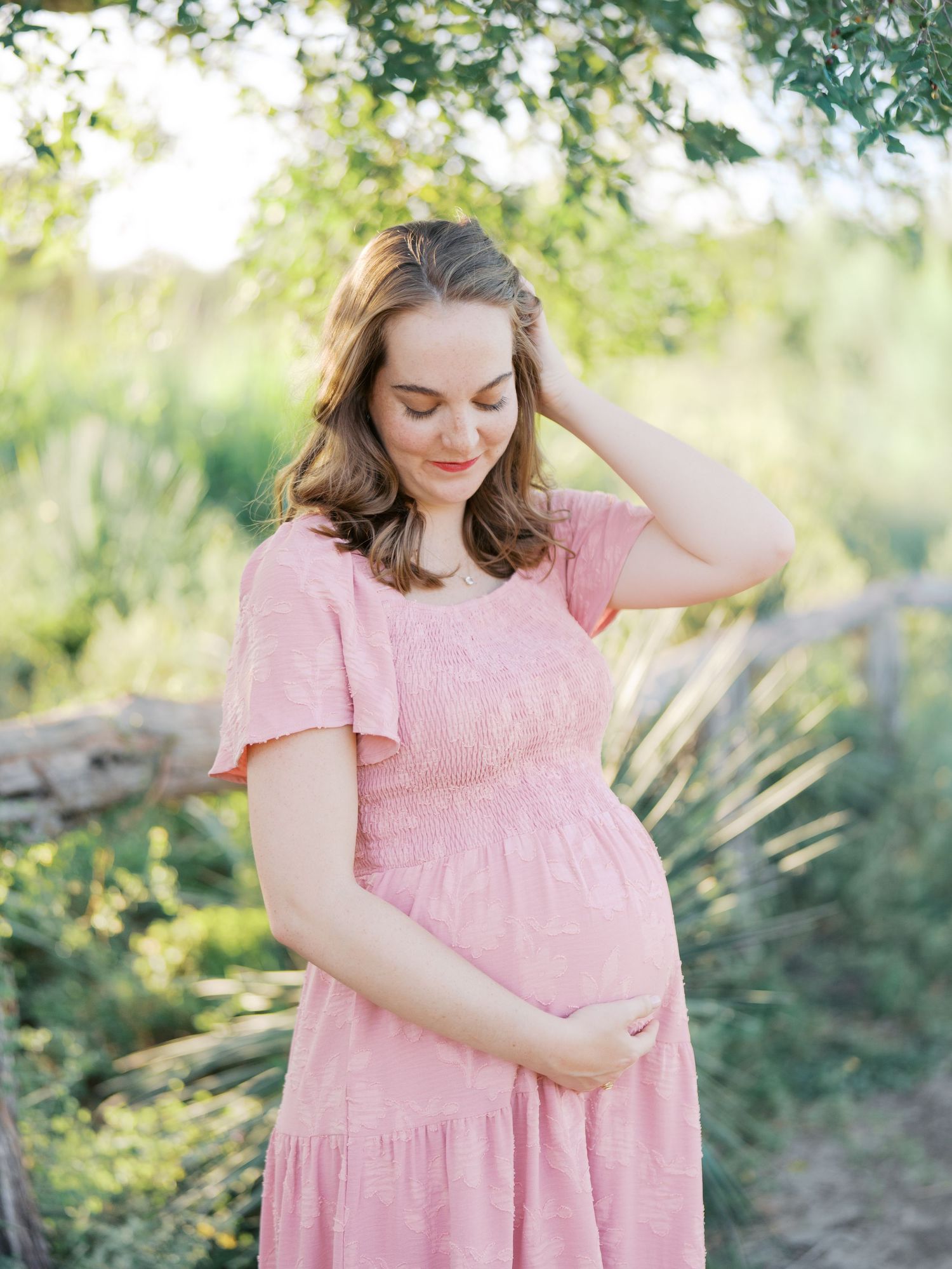 Pregnant mother posing outdoors during a San Antonio maternity photography session at Phil Hardberger Park
