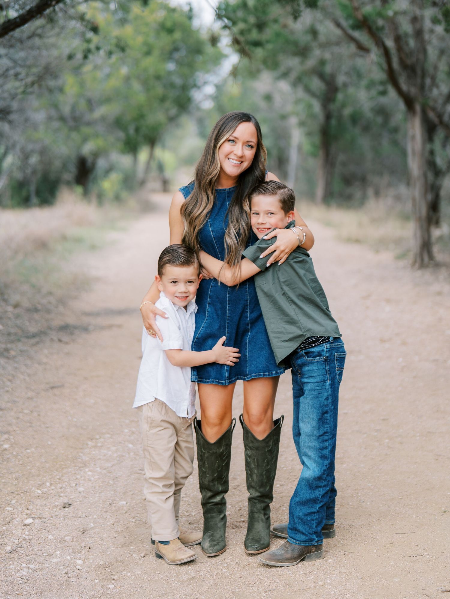Mother smiling with her young child during an outdoor family photography session
