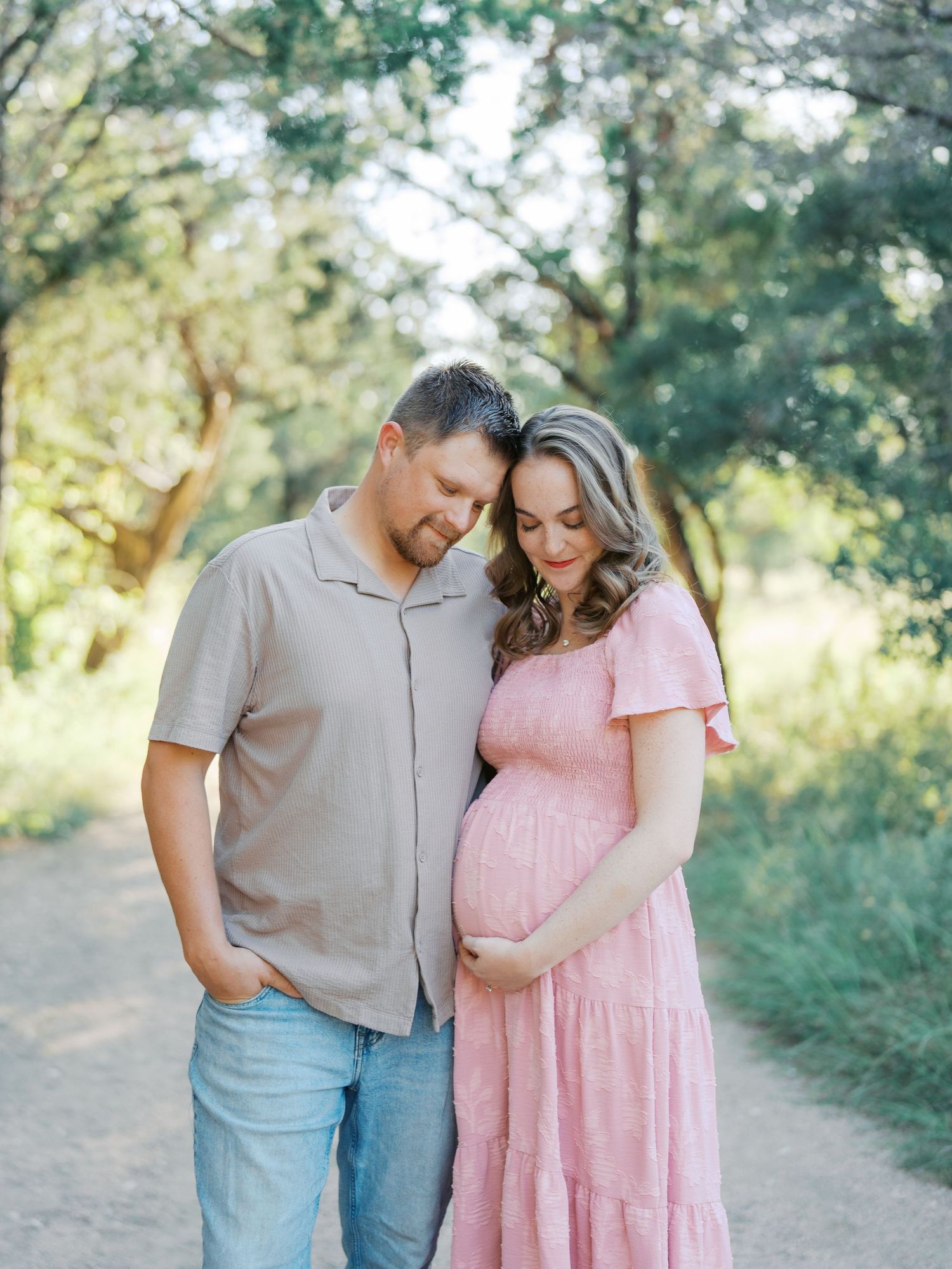 Expecting parents during an outdoor maternity session in San Antonio