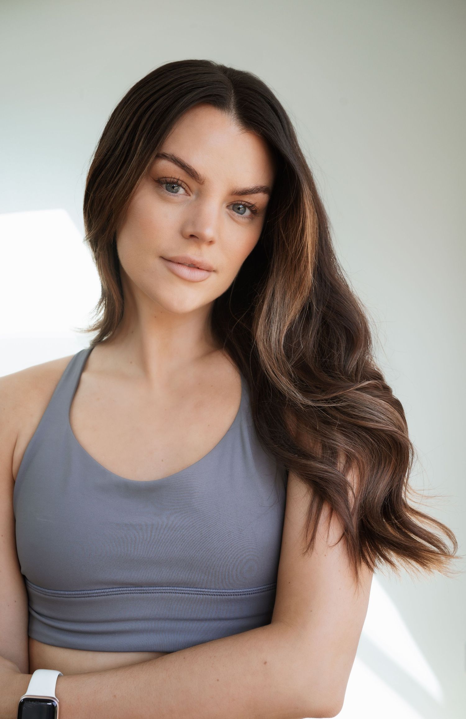 Beauty themed photo of a Dancer and Model with long wavy hair. Dancer/Model headshot