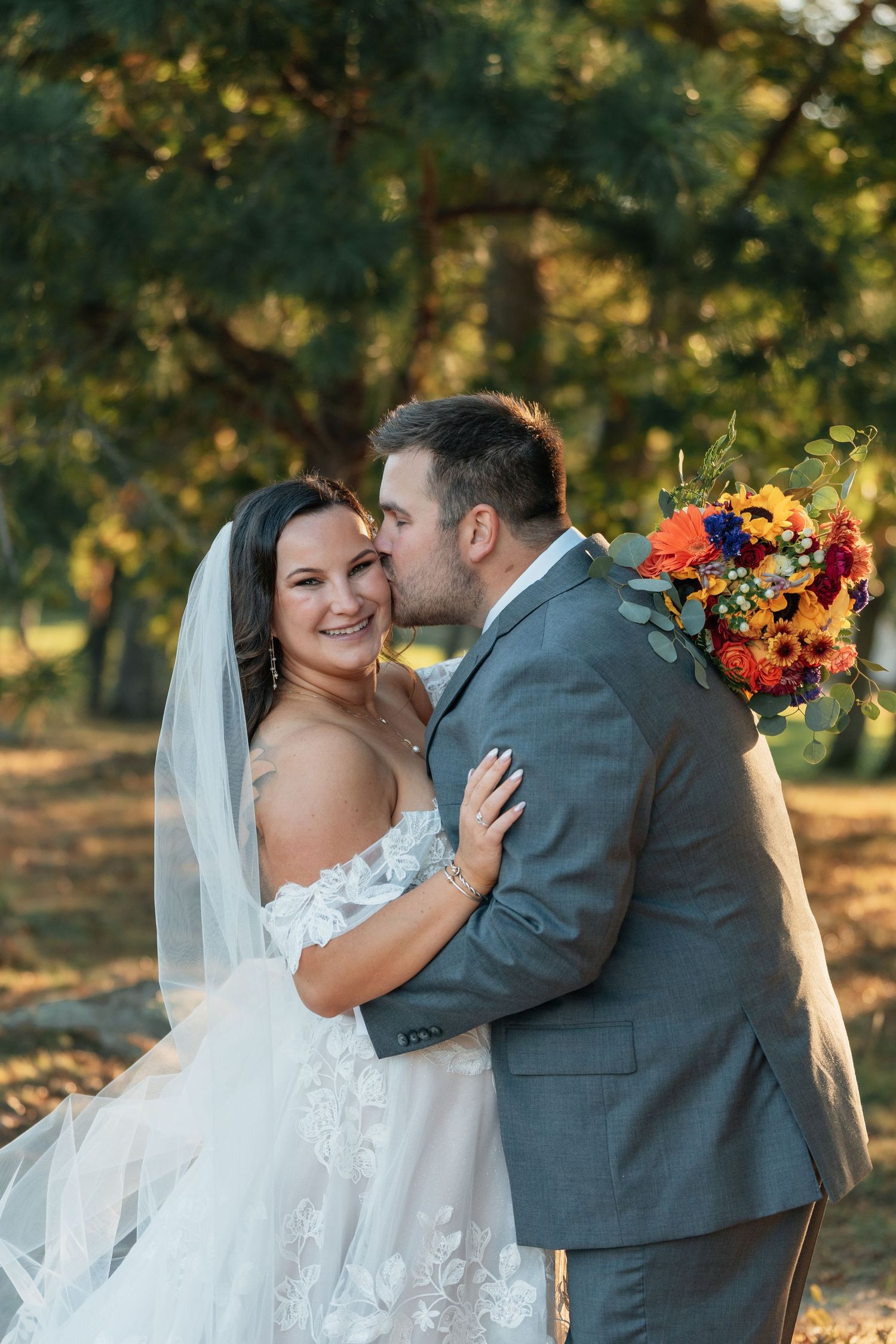 A romantic autumn wedding photo sequence showing a couple embracing outdoors with vibrant fall flowers.