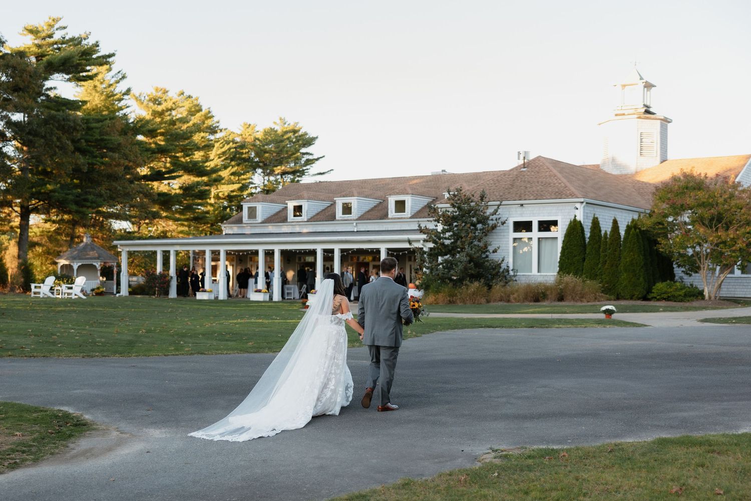 Wide landscape view of wedding venue exterior and grounds.