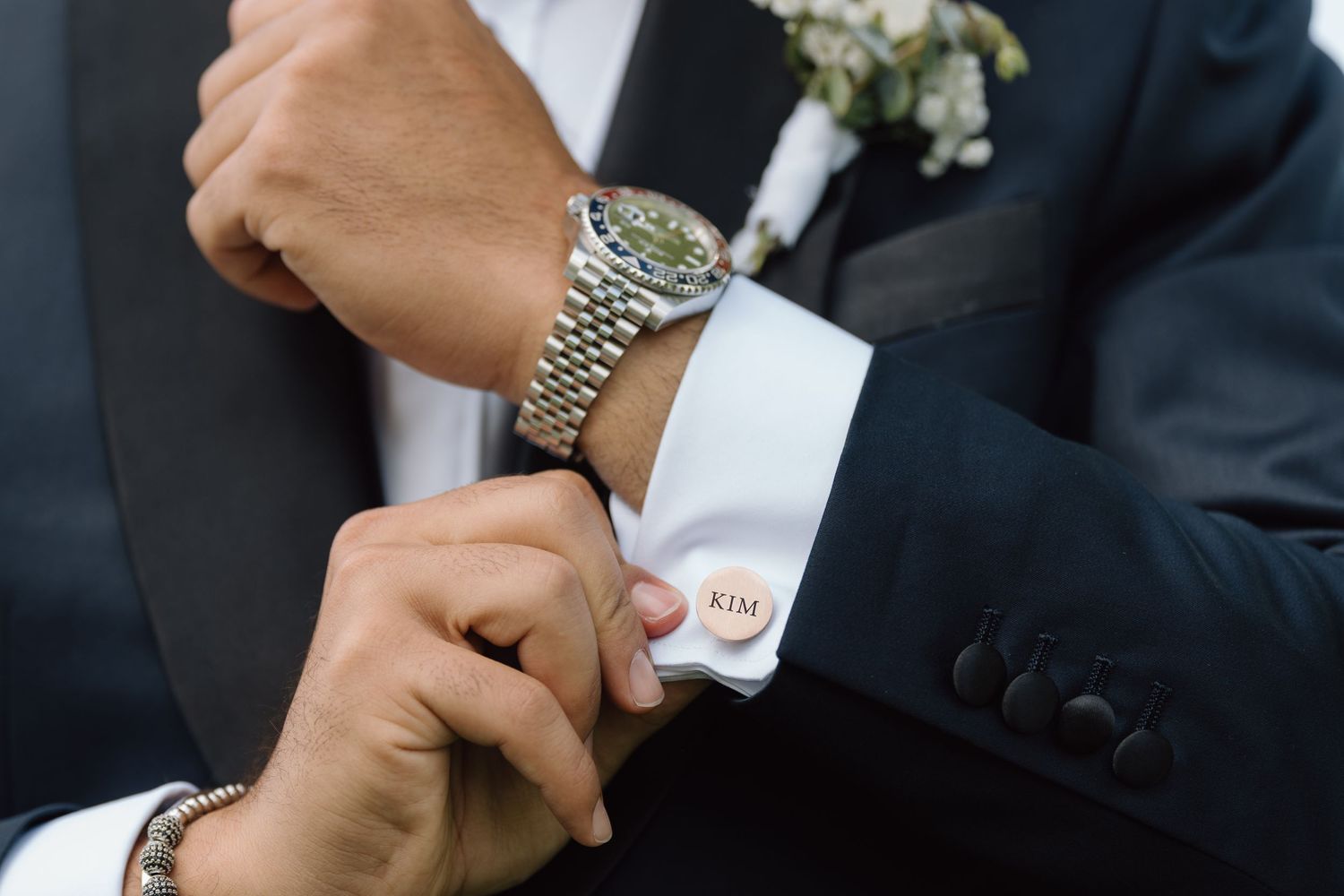 Detail shots of wedding attire and accessories in black and white.