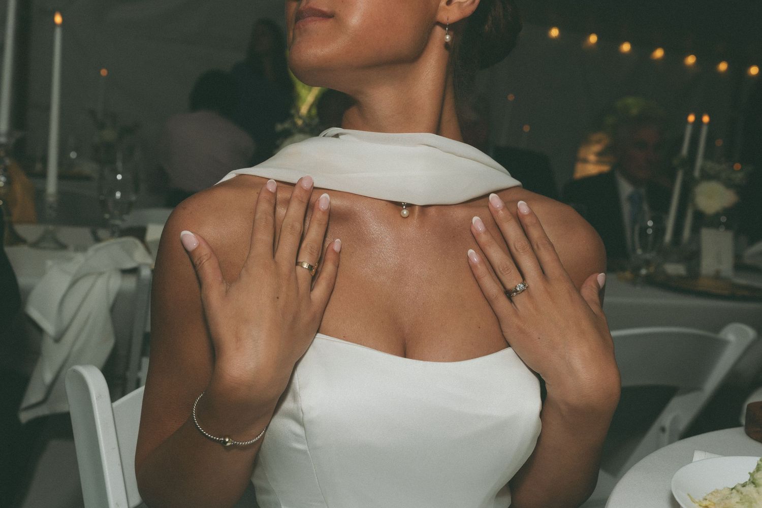 Wedding celebration with string lights creating romantic ambiance.