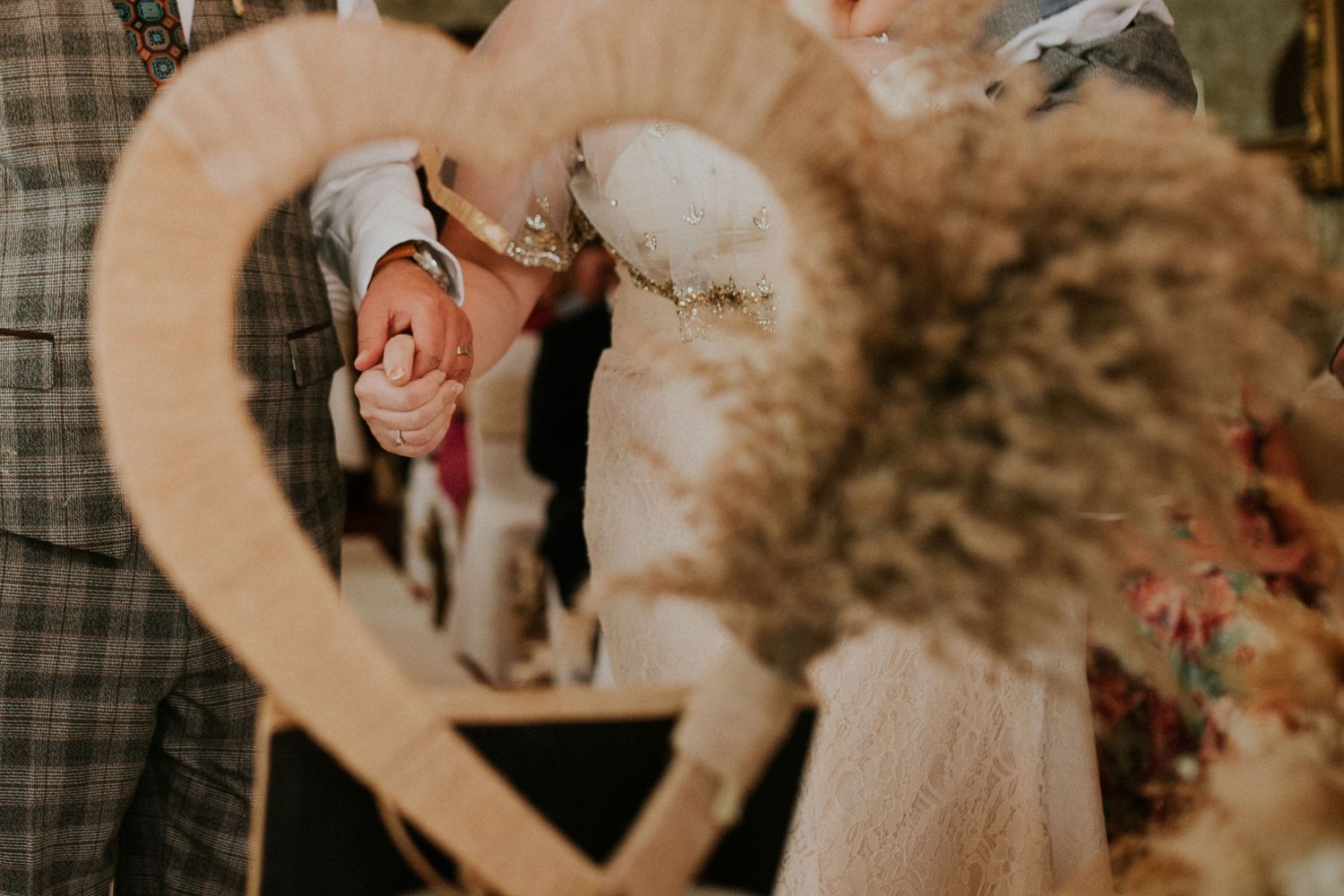 Intimate wedding venue with soft warm lighting and rustic decor.
