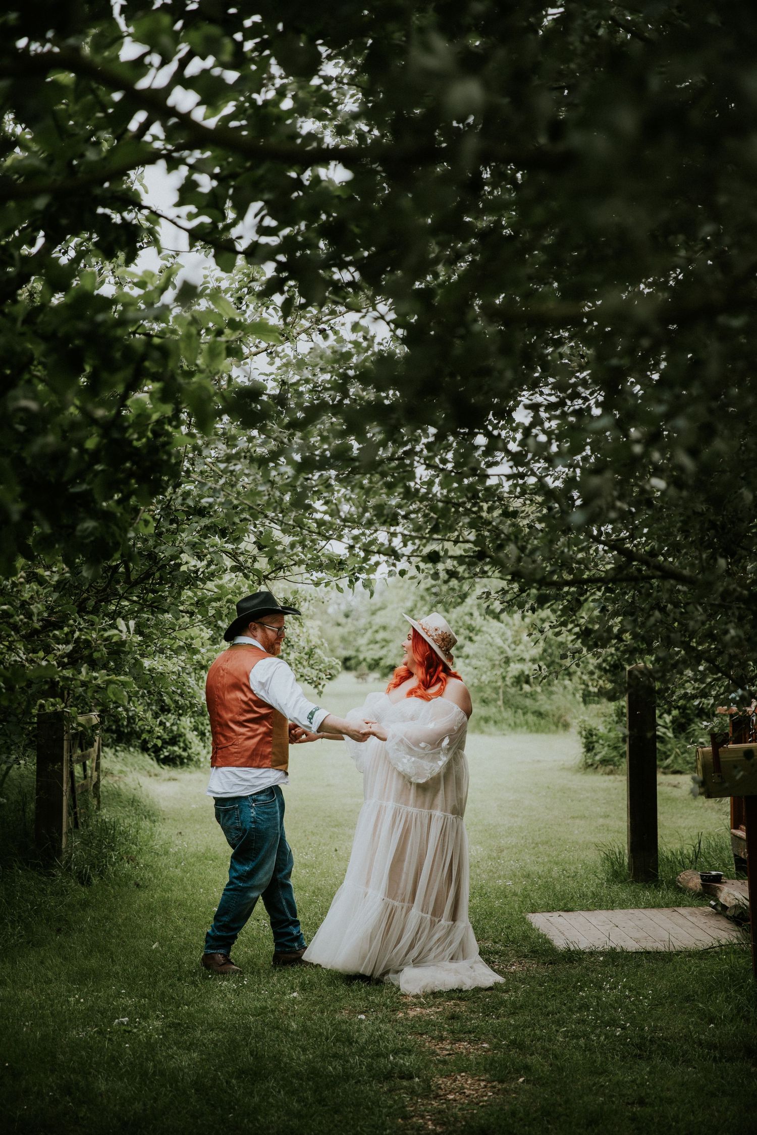 Candid moments photographed in a serene garden pathway.