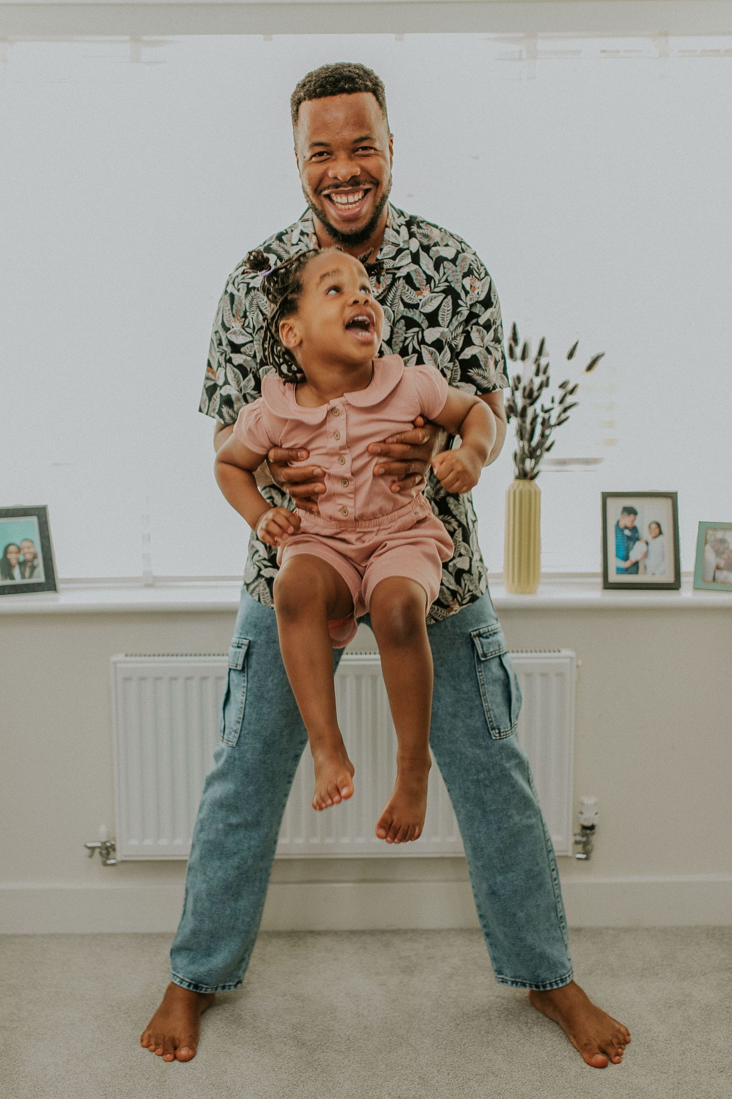 Playful indoor lifestyle photos showing joyful movement and interaction.