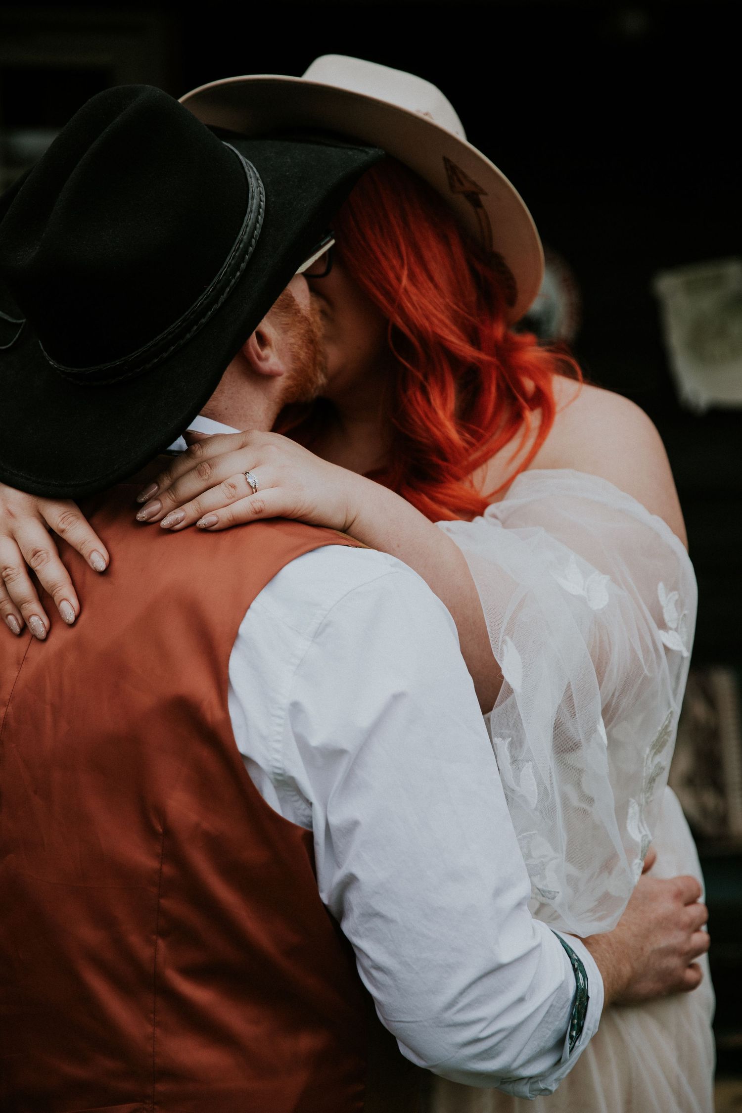 Intimate closeup shot focusing on tender embrace and details.