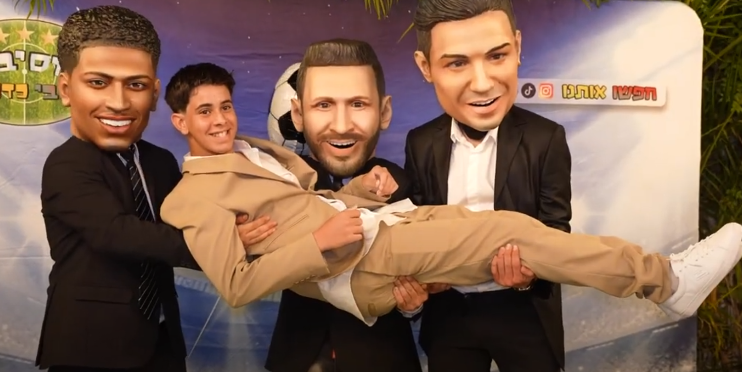 Four cardboard cutout figures posed together in a playful carrying position against a colorful background.