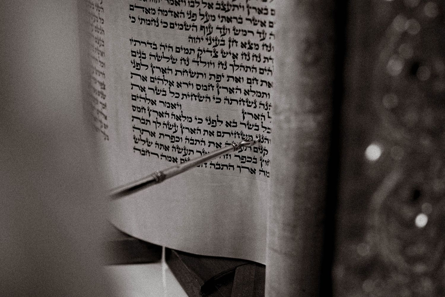 Close-up of Hebrew text on a scroll or religious document.