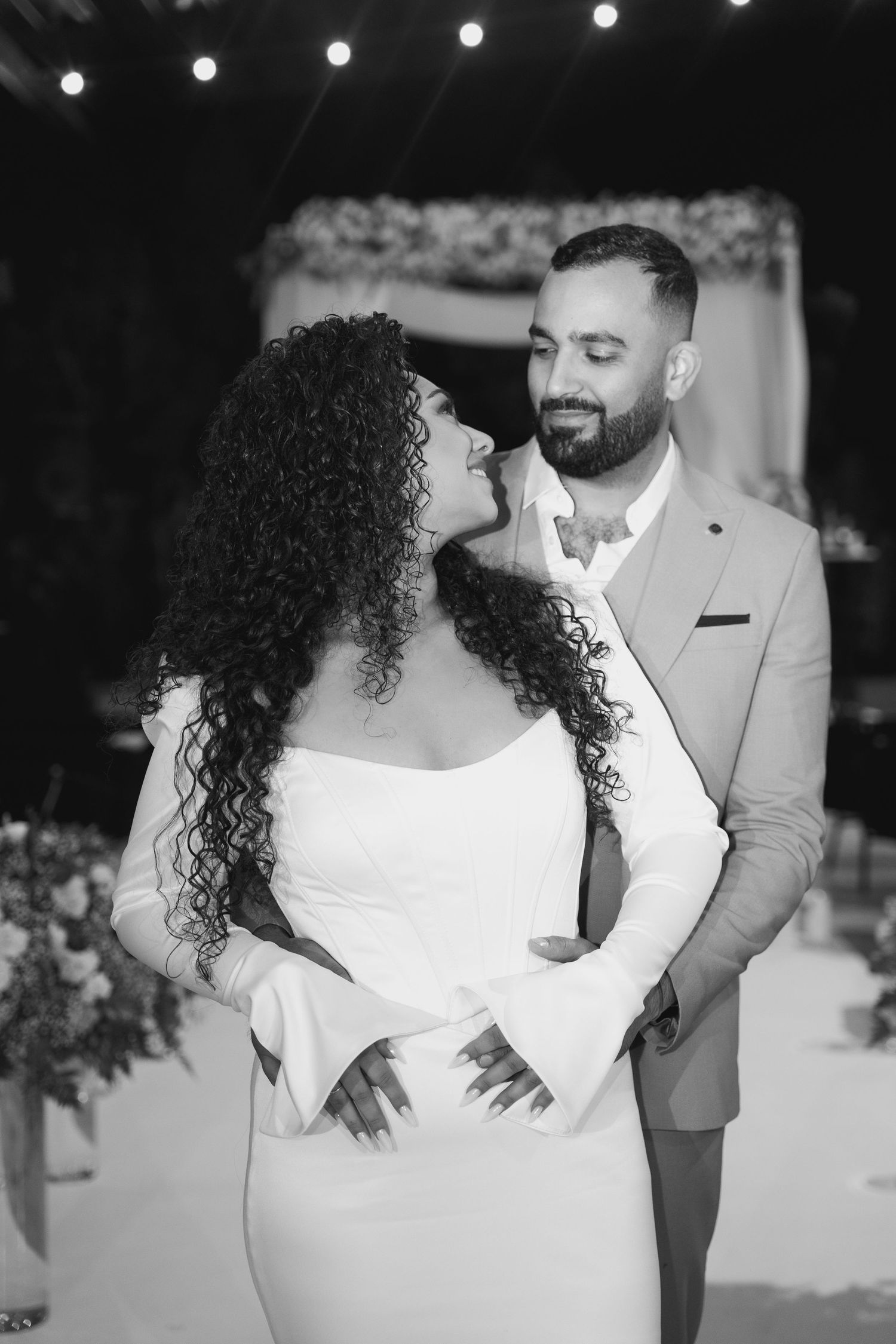 Black and white wedding photography capturing intimate moments between newlyweds.