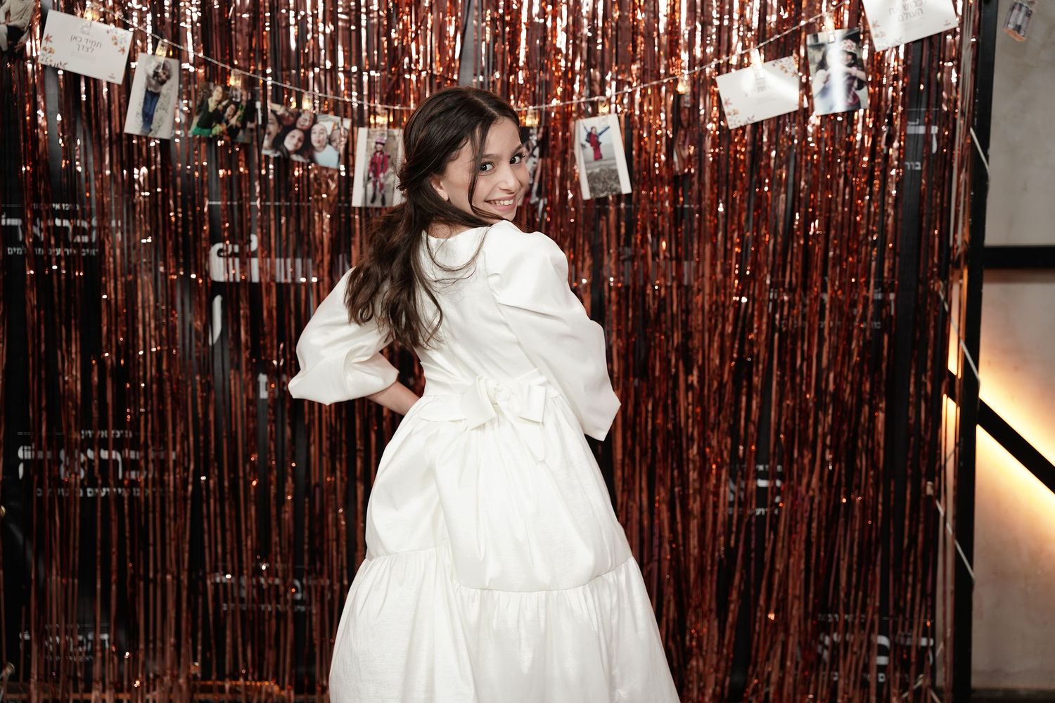 A series of connected photos showing a person in a white dress against a shimmery copper-colored backdrop.