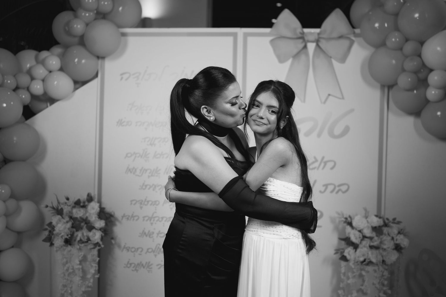 An emotional moment captured in black and white during a special celebration.