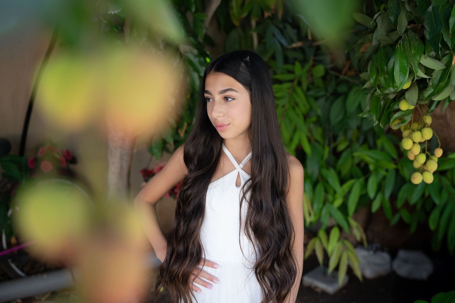 Candid garden photoshoot with soft focus and natural lighting effects.