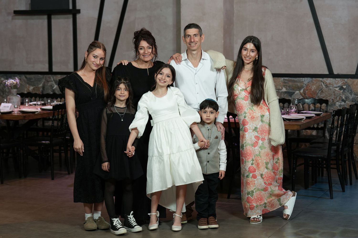 A series of candid family photos arranged in a horizontal strip showing people at what appears to be a party or gathering.