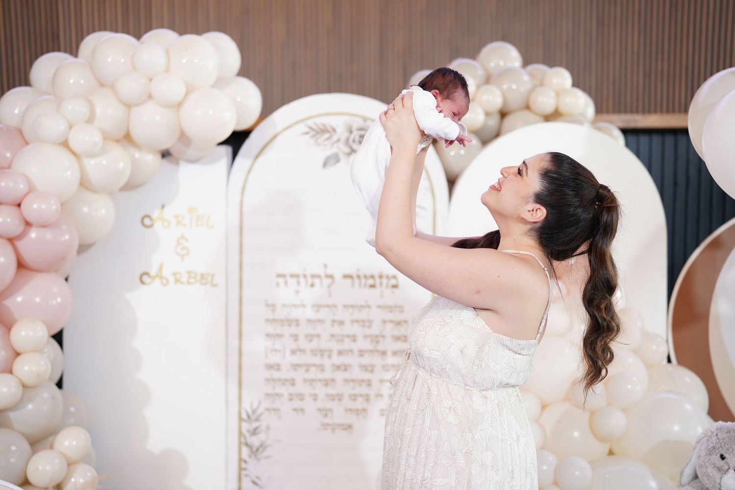 Wedding photography series featuring elegant balloon wall and romantic moments.