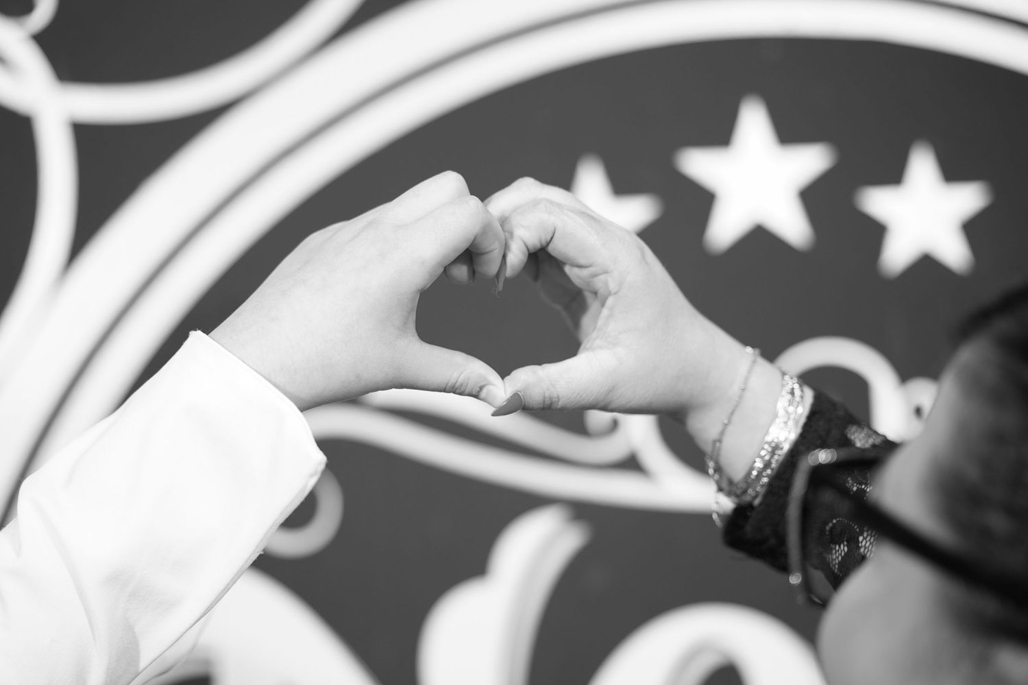 Artistic black and white photo sequence with ornamental backdrop design.