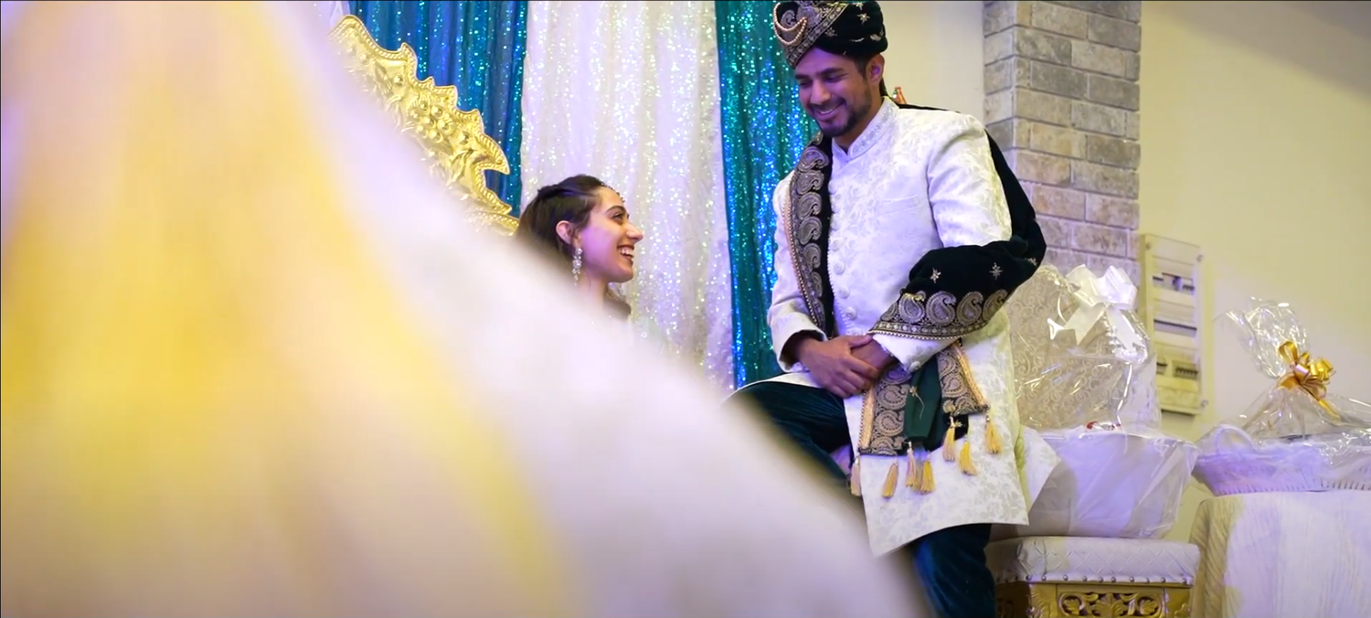 A candid moment captured through decorative elements with soft yellow lighting effects.