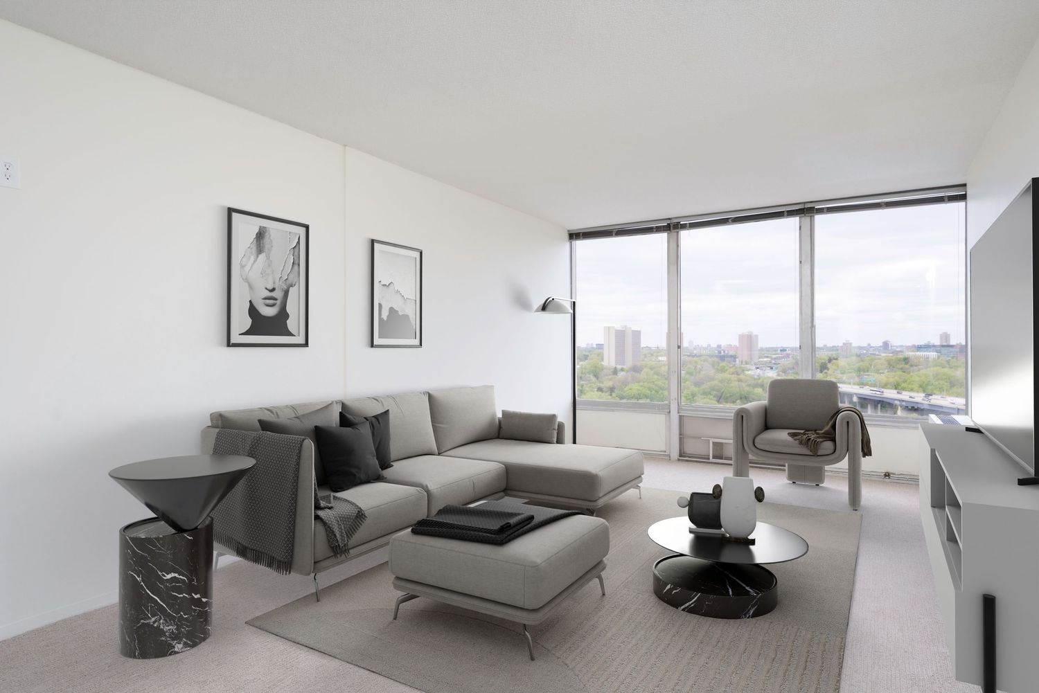 Modern minimalist living room with gray sectional sofa, floor-to-ceiling windows, and panoramic city views.