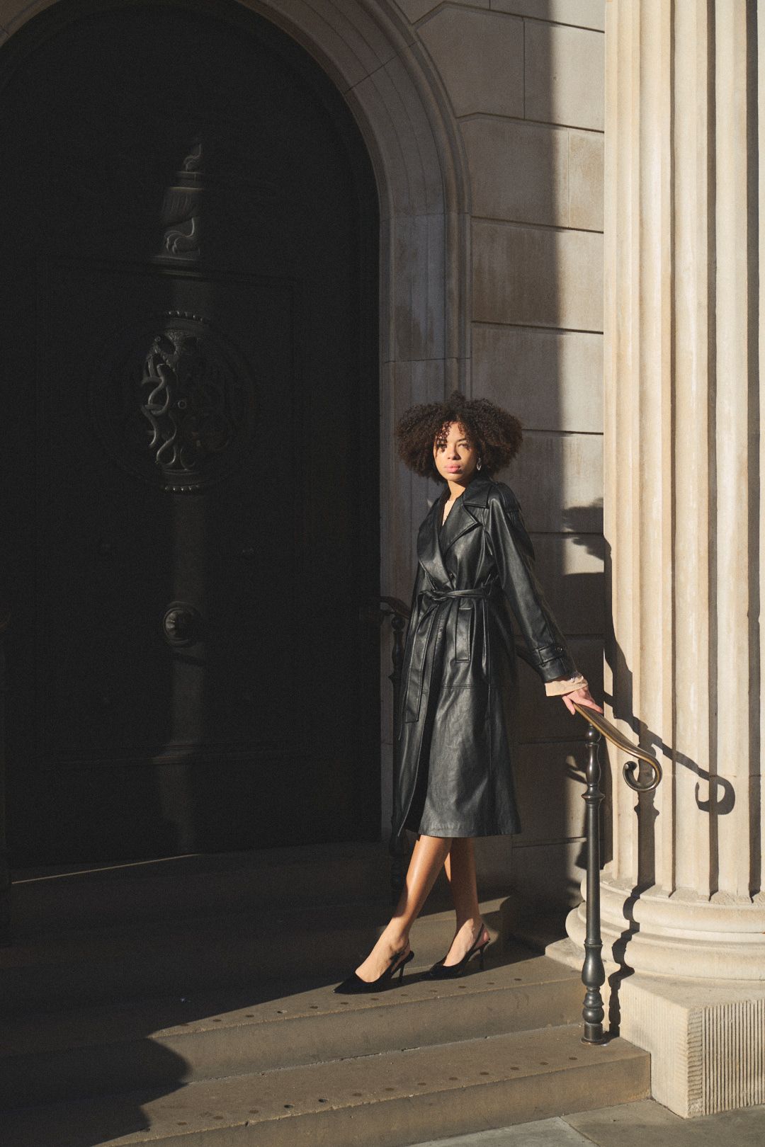 Artistic photo sequence of someone posing in a black leather jacket near classical stone columns.