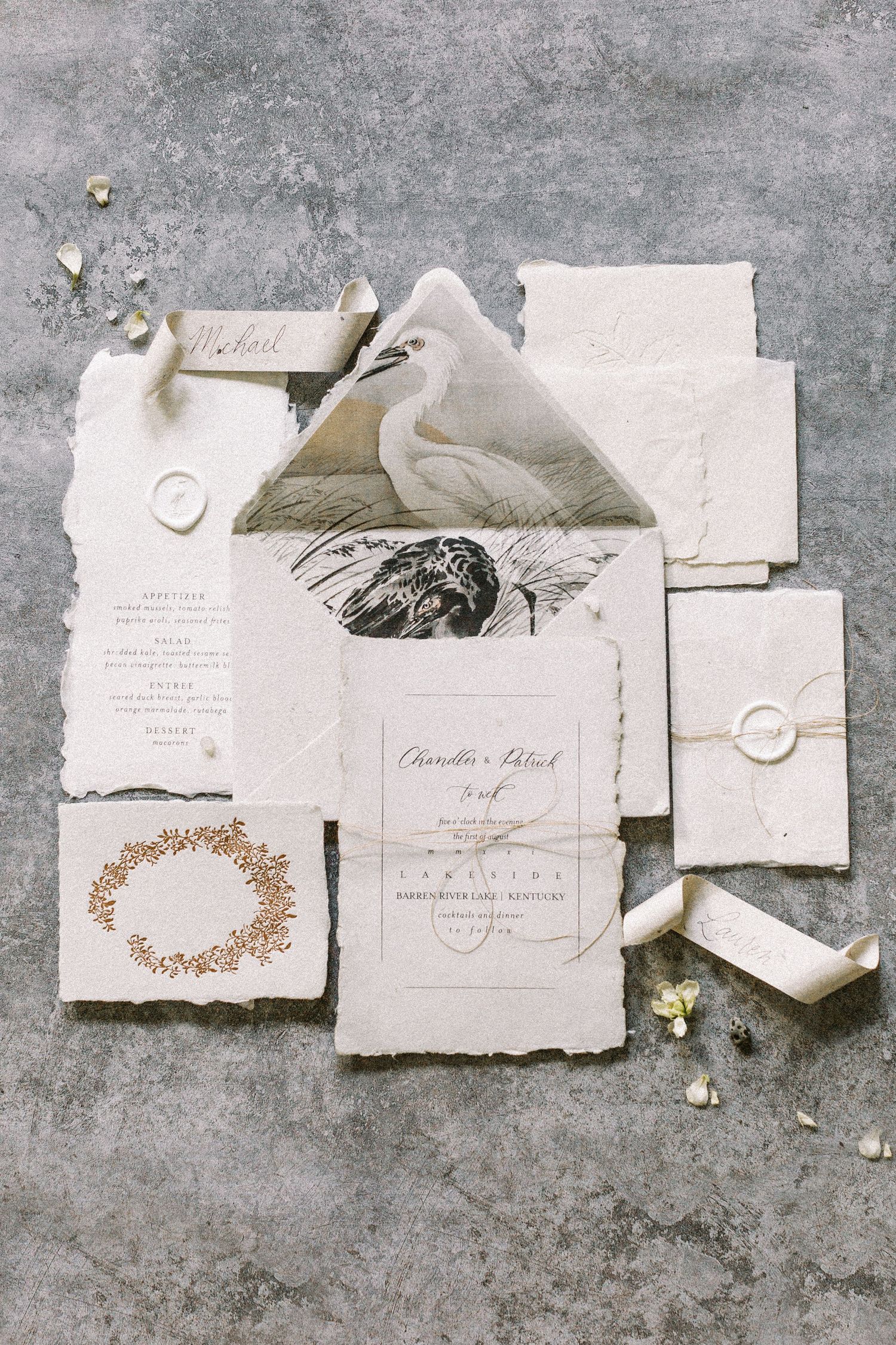 Artistic flat lay of vintage-style wedding stationery with wax seals and delicate details. Kirstie Whitaker Photography