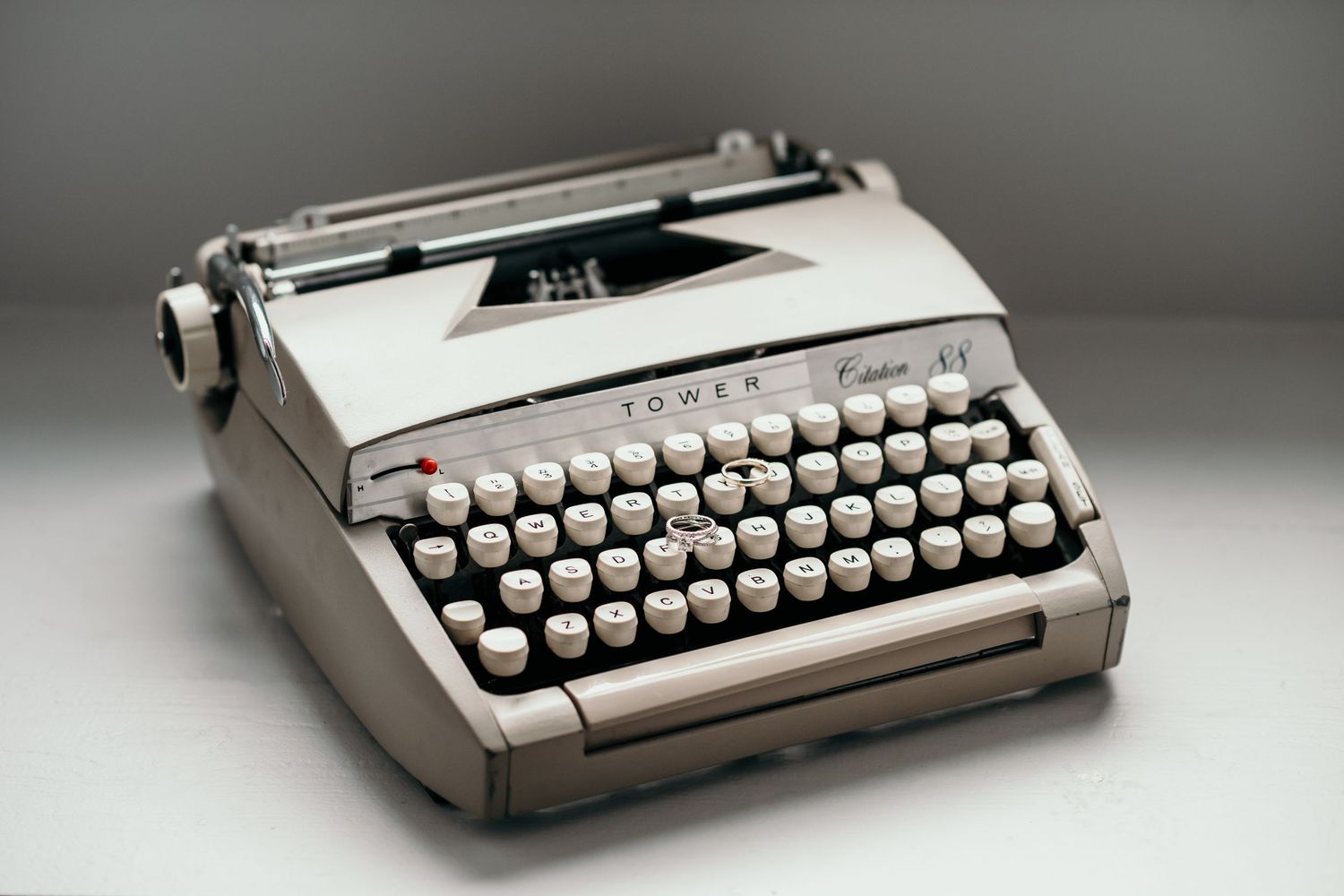 The Citation 88 typewriter that started it all. Dan and I wrote our vows on this typewriter. Pictured with our wedding rings.