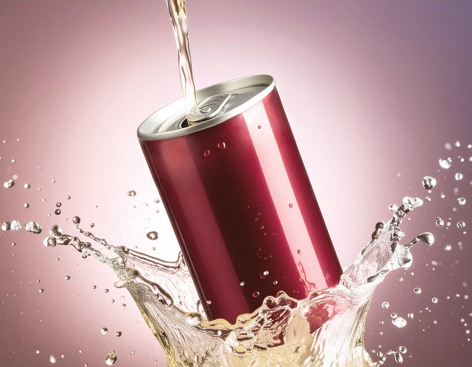 A red aluminum soda can splashing in liquid with dynamic water droplets on a pink gradient background.