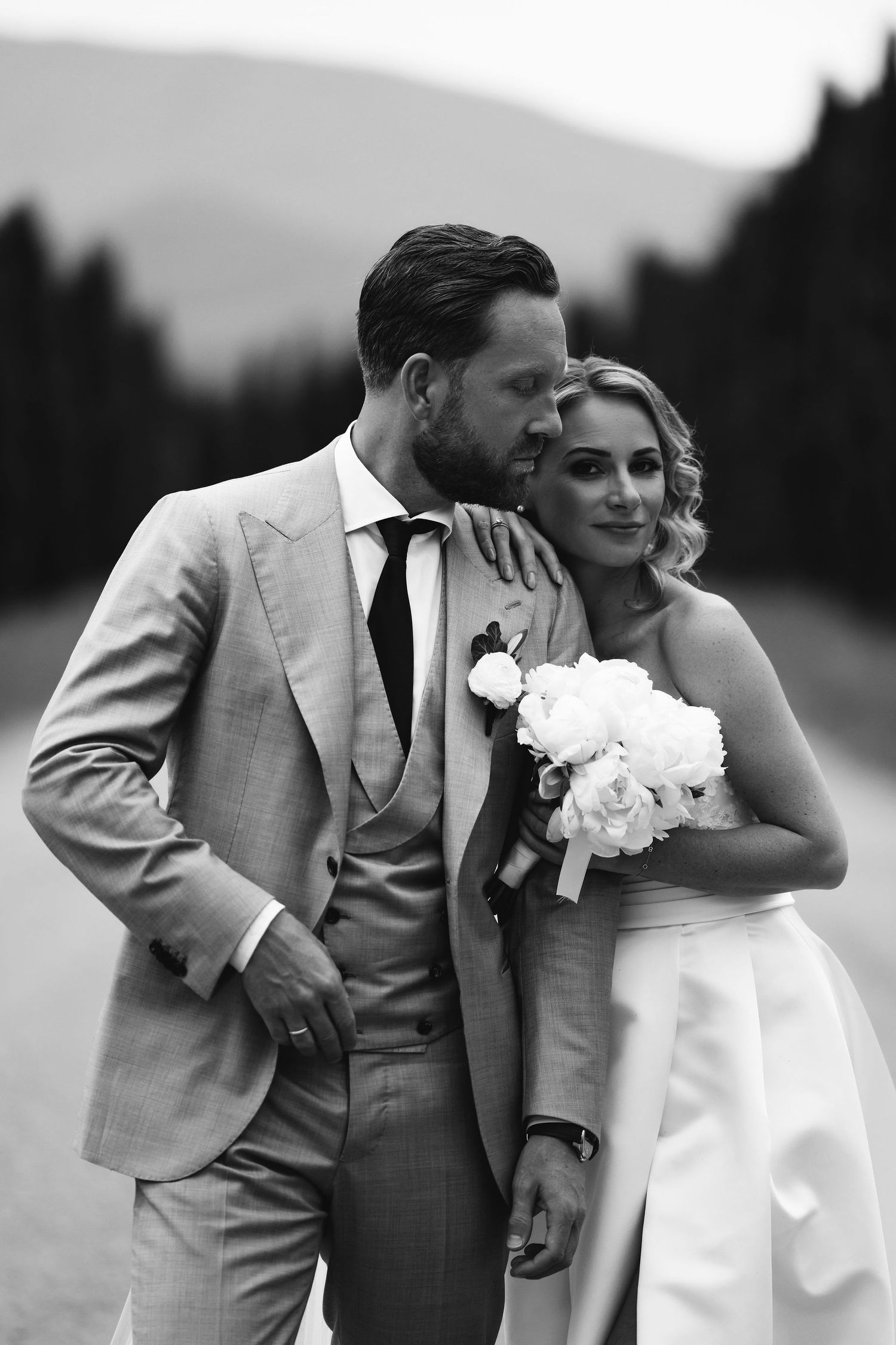 Black and white series of romantic wedding portraits showing tender moments between the couple.