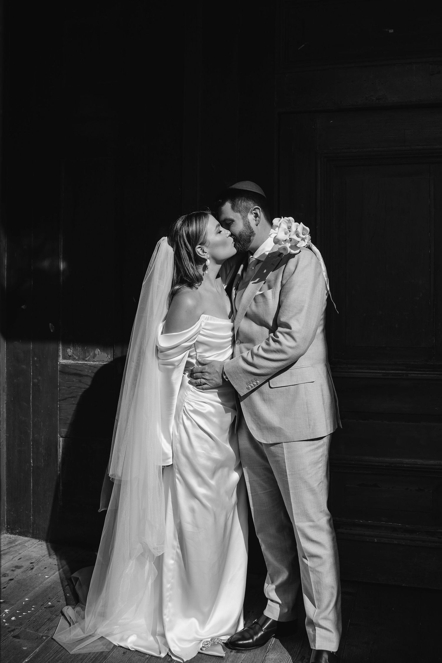 Romantic black and white wedding portraits captured in an intimate setting.